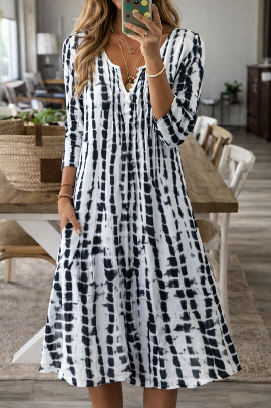 Elegantní midi šaty Zarusova do A s výstřihem do V